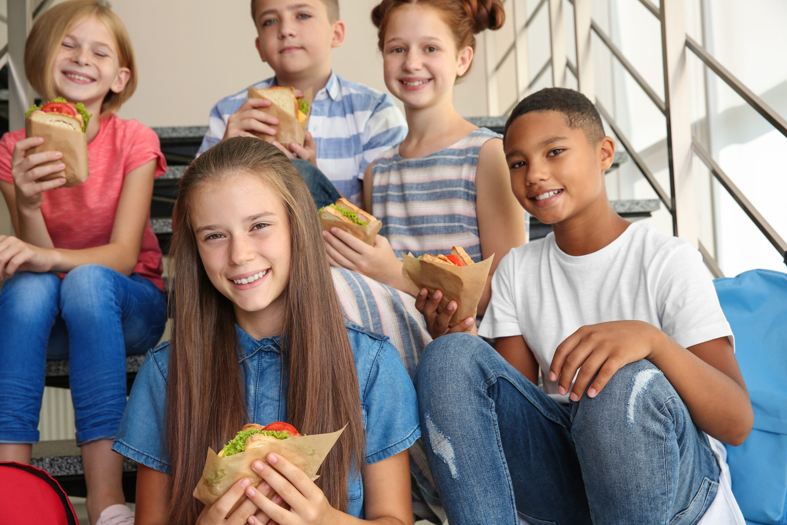 Children on stairs eating